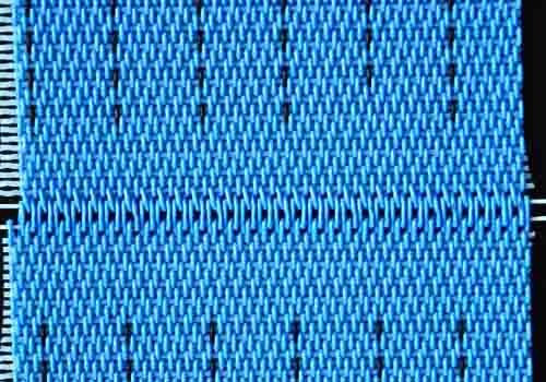 Double self-loop interlocked seam on a press belt