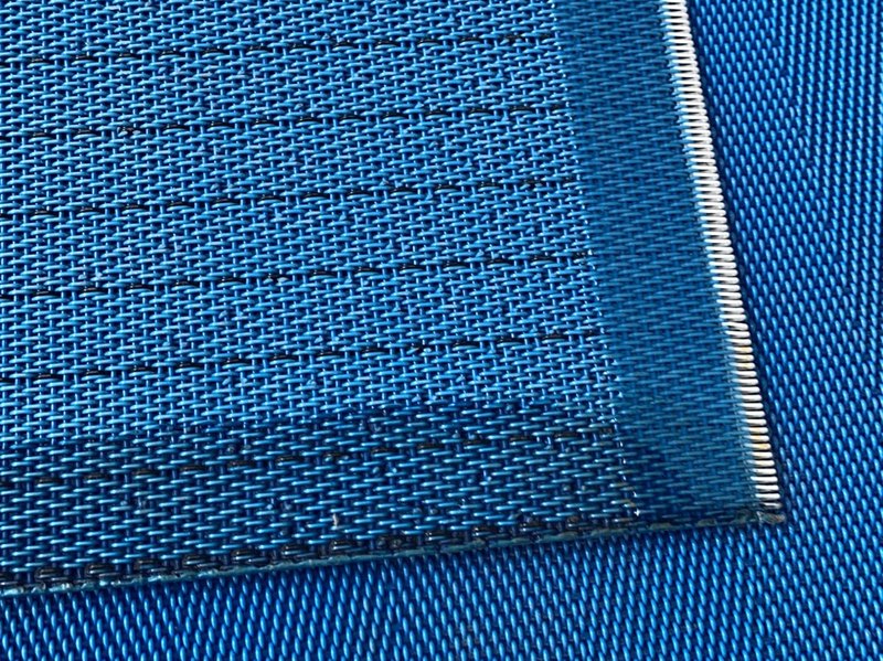 PEEK spiral joint on an anti-static dryer fabric, close-up