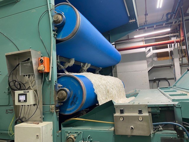 Customer case: wool scouring dryer running a blue anti-static dryer belt with wool on the belt