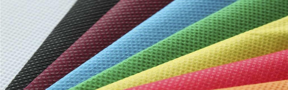 Nonwoven production line with forming belt carrying the fiber web